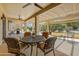 Comfortable covered patio with an outdoor table and chairs, perfect for enjoying the outdoors at 15532 W Prairie Dunes Dr, Surprise, AZ 85374