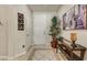 Inviting entryway with tiled floors, a console table, and tasteful decorations at 15532 W Prairie Dunes Dr, Surprise, AZ 85374