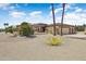 Beautiful single-story home with a well-maintained lawn and two-car garage at 15532 W Prairie Dunes Dr, Surprise, AZ 85374