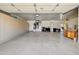 Spacious three-car garage with lots of space and with built-in cabinets for storage at 15532 W Prairie Dunes Dr, Surprise, AZ 85374
