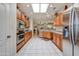 Modern kitchen boasting stainless steel appliances, sleek countertops, and ample cabinet space at 15532 W Prairie Dunes Dr, Surprise, AZ 85374