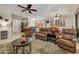 Spacious living room seamlessly connecting to the kitchen and dining area, perfect for modern living at 15532 W Prairie Dunes Dr, Surprise, AZ 85374
