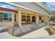 Covered patio with comfortable seating, a grill and great overhead covering from the sun at 15532 W Prairie Dunes Dr, Surprise, AZ 85374