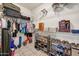 Spacious walk-in closet with plenty of storage space and organized shelving for clothes, shoes and other items at 15532 W Prairie Dunes Dr, Surprise, AZ 85374
