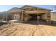 Exterior view of a new home under construction, highlighting wood framing and the structure at 15752 W Camden Ave, Waddell, AZ 85355