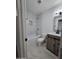 Inviting bathroom with vanity, bathtub, decorative tile and updated fixtures at 1627 W Pueblo Ave, Mesa, AZ 85202
