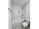 Cozy bathroom featuring a bathtub, decorative tile inset and updated fixtures at 1627 W Pueblo Ave, Mesa, AZ 85202