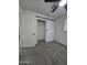 This bedroom features carpet, a sliding closet door and a ceiling fan at 1627 W Pueblo Ave, Mesa, AZ 85202