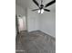 Cozy bedroom featuring neutral carpet, a ceiling fan and a closet with double doors at 1627 W Pueblo Ave, Mesa, AZ 85202