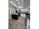 Updated kitchen featuring stainless steel appliances, a practical island, and ample cabinet space at 1627 W Pueblo Ave, Mesa, AZ 85202