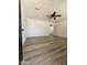 Bright living room featuring new plank flooring and white walls, ready for personalized touches at 1627 W Pueblo Ave, Mesa, AZ 85202