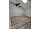 Bright living room with vaulted ceilings, plank flooring, and natural light creates a welcoming atmosphere at 1627 W Pueblo Ave, Mesa, AZ 85202
