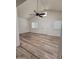 Inviting living area with vaulted ceilings, plank flooring, and ample natural light at 1627 W Pueblo Ave, Mesa, AZ 85202