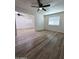 Bright living room with new flooring, white walls, and an open view into the adjacent living space at 1627 W Pueblo Ave, Mesa, AZ 85202
