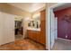 Bathroom vanity with double door access to walk-in closet at 16781 W Northampton Rd, Surprise, AZ 85374