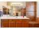 Bathroom vanity features double sinks, large mirror and view into the walk-in shower at 16781 W Northampton Rd, Surprise, AZ 85374