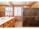 Bathroom features double sinks, an oversized walk-in shower, and stylish tile accents at 16781 W Northampton Rd, Surprise, AZ 85374