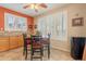 Dining area featuring plantation shutters and views to backyard at 16781 W Northampton Rd, Surprise, AZ 85374