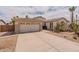 Inviting single-story home with a two-car garage and xeriscaping at 16781 W Northampton Rd, Surprise, AZ 85374