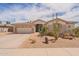 Charming single-story home with desert landscaping, a two-car garage and a tile roof at 16781 W Northampton Rd, Surprise, AZ 85374