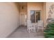 Cozy front porch with white rocking chairs and a peaceful outdoor ambiance at 16781 W Northampton Rd, Surprise, AZ 85374