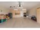 Spacious garage features epoxy floors, built-in cabinets, and ample storage, perfect for organization at 16781 W Northampton Rd, Surprise, AZ 85374