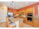Spacious kitchen with granite countertops, stainless steel appliances, and custom backsplash at 16781 W Northampton Rd, Surprise, AZ 85374