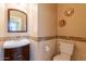 Stylish powder room with a modern sink and vanity, a decorative mirror, and contemporary design elements at 16781 W Northampton Rd, Surprise, AZ 85374