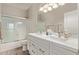 Elegant bathroom featuring a double sink vanity with sleek countertops and a shower-tub combination at 16803 N 49Th Way, Scottsdale, AZ 85254