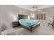 Spacious bedroom features a wooden bed frame, ceiling fan, and neutral color scheme at 16803 N 49Th Way, Scottsdale, AZ 85254