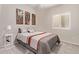 Cozy bedroom showcasing neutral walls, a comfortable bed, and a window for natural light at 16803 N 49Th Way, Scottsdale, AZ 85254