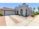 Inviting home featuring a tile roof, arched entryway, and a two-car garage at 16803 N 49Th Way, Scottsdale, AZ 85254