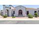 Charming home featuring a stucco exterior, arched entryway, and a well-maintained front yard at 16803 N 49Th Way, Scottsdale, AZ 85254