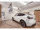Organized garage with ample storage cabinets, electric car charger, and a ceiling mounted bike rack at 16803 N 49Th Way, Scottsdale, AZ 85254