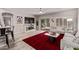 Bright living room with wood floors, ceiling fan, a fireplace and sliding doors to the backyard at 16803 N 49Th Way, Scottsdale, AZ 85254