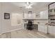 Bright home office with custom built-ins, ample desk space, and modern light hardwood flooring at 16803 N 49Th Way, Scottsdale, AZ 85254