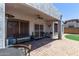 Relaxing covered patio featuring comfortable seating, ceiling fan, and a view of the lush backyard at 16803 N 49Th Way, Scottsdale, AZ 85254