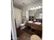 Bathroom featuring double sinks, decorative mirrors, and a neutral-toned shower curtain at 1725 N Date -- # 8, Mesa, AZ 85201