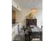 Elegant dining room featuring a stylish chandelier and wet bar, perfect for hosting gatherings at 1725 N Date -- # 8, Mesa, AZ 85201