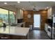 Bright kitchen features white cabinets, stainless steel appliances, and wood backsplash at 1725 N Date -- # 8, Mesa, AZ 85201