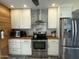 Modern kitchen featuring stainless steel appliances, white cabinetry, and sleek countertops for a clean design at 1725 N Date -- # 8, Mesa, AZ 85201