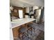 Stylish kitchen showcasing an island with seating, stainless steel appliances, and eye-catching backsplash at 1725 N Date -- # 8, Mesa, AZ 85201