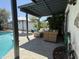 Charming covered patio with comfortable wicker furniture and a beautiful view of the sparkling pool at 1725 N Date -- # 8, Mesa, AZ 85201