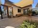 Back patio area featuring desert landscaping, privacy wall, and shade awning at 1725 N Date -- # 8, Mesa, AZ 85201
