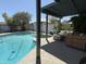 Backyard pool with an inviting lounge area and shade, offering an outdoor oasis for relaxation at 1725 N Date -- # 8, Mesa, AZ 85201