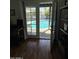 View of pool through the double glass patio doors to the beautiful outdoor area at 1725 N Date -- # 8, Mesa, AZ 85201