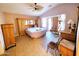 Relaxing main bedroom featuring vaulted ceiling, tiled floor, and a king-size bed at 17257 W Papago St, Goodyear, AZ 85338