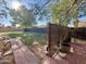 Backyard featuring a brick pathway, patio and a mature shade tree at 1742 W Butler Dr, Phoenix, AZ 85021