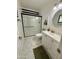 Updated bathroom featuring a glass enclosed shower, white vanity and modern fixtures at 1742 W Butler Dr, Phoenix, AZ 85021