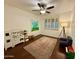 Playroom featuring a play kitchen, ceiling fan and a large area rug at 1742 W Butler Dr, Phoenix, AZ 85021